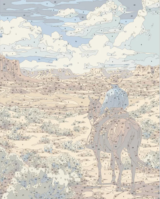 Cowboy Riding Across Desert